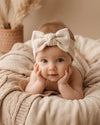 Knitted baby headband with bow in ivory - Eli&Eli Dubai