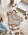 Knitted bow comforter and pacifier holder in beige - Eli&Eli Dubai