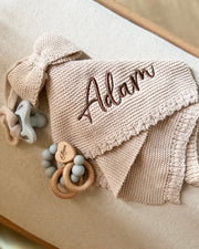 Knitted bow comforter and pacifier holder in beige - view 2 | Eli&Eli