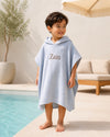 Personalised hooded muslin poncho towel in stone grey for babies and kids - Eli&Eli Dubai