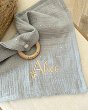 Personalised muslin comforter blanket with wooden teether in gold blue - view 2 | Eli&Eli