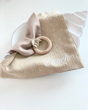 Personalised muslin comforter blanket with wooden teether in olive - view 11 | Eli&Eli