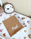 Personalised cotton muslin baby blanket with brown dinosaur print and stroller hanger - Eli&Eli Dubai