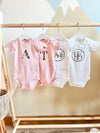 Personalised poppy short sleeve baby onesie in pink organic cotton with name - Eli&Eli Dubai