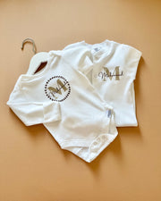 Signature print long sleeve baby onesie in white - view 11 | Eli&Eli