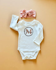 Signature print long sleeve baby onesie in white - view 3 | Eli&Eli